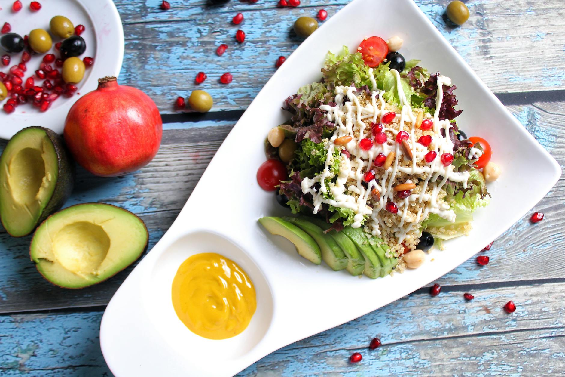 quinoa rice with avocado slices on ceramic plate